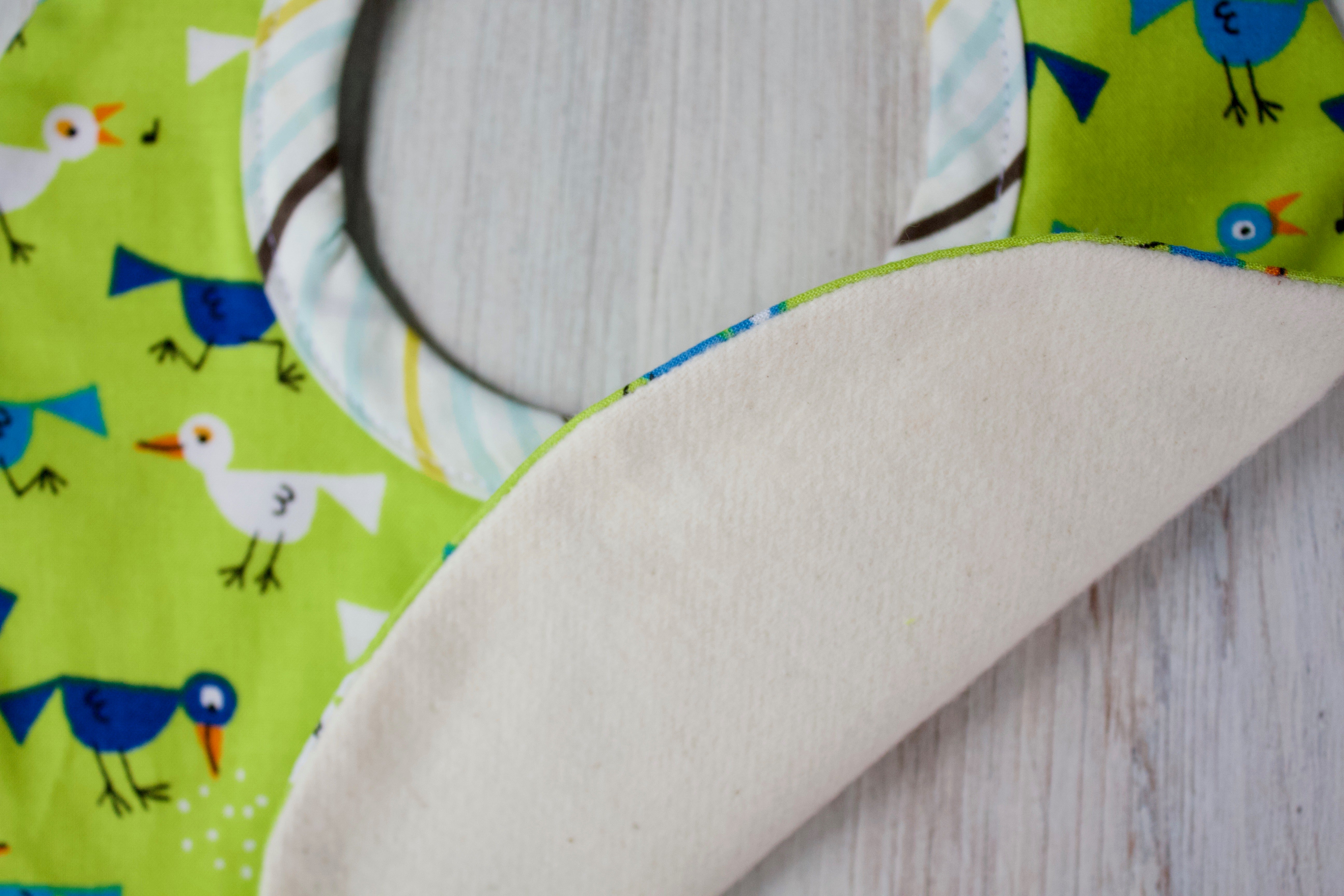 Bitsy the Bird Bib-The Blue Peony-Animal_Bird,Category_Bib,Color_Blue,Color_Lime Green,Department_Organic Baby,Material_Organic Cotton,Pattern_Ed Emberley's Animals,Theme_Animal