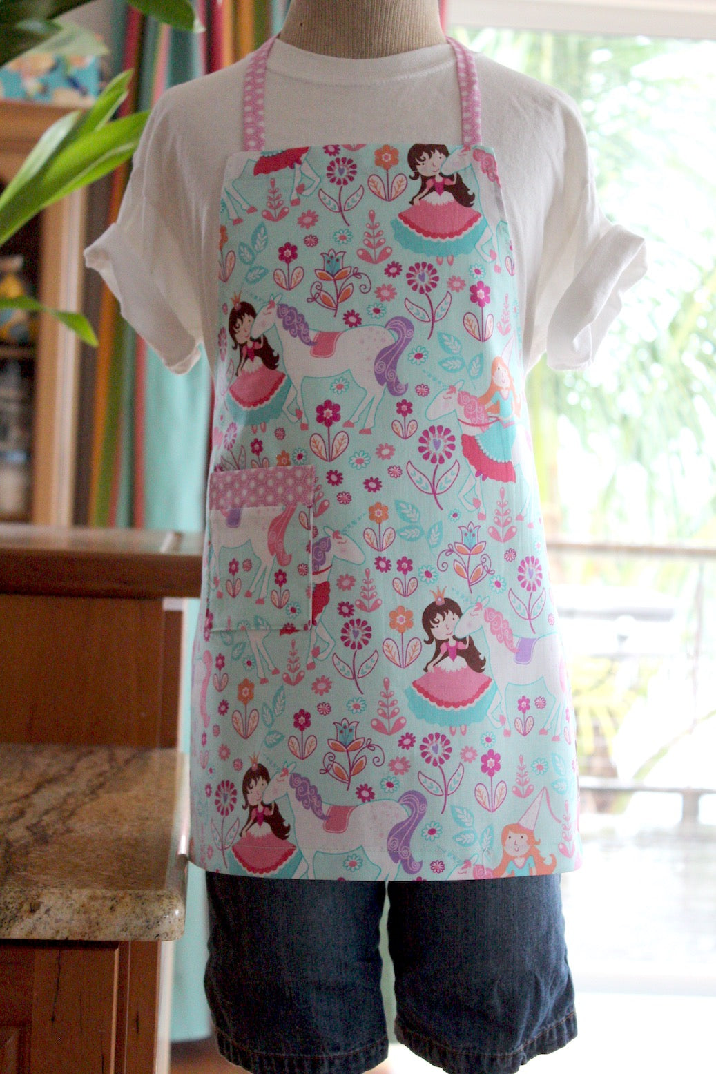 Princesses and Unicorns Kid's Apron-The Blue Peony-Age Group_Kids,Category_Apron,Color_Aqua,Color_Pink,Department_Kitchen,Gender_Girls,Material_Cotton,Size_Medium (ages 6-11),Size_Small (ages up to 5),Theme_Animal