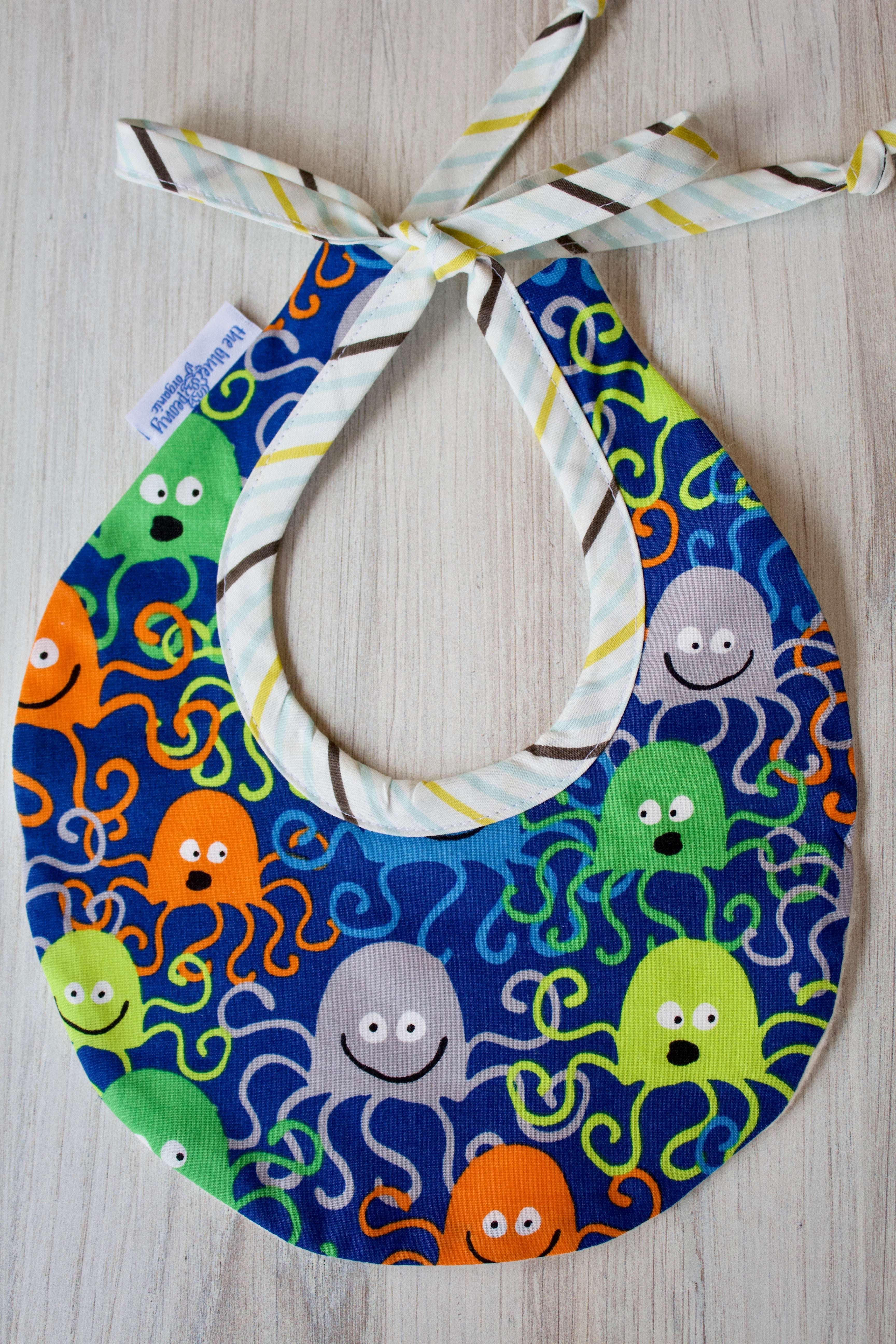 Brainy the Octopus Bib-The Blue Peony-Animal_Octopus,Category_Bib,Color_Blue,Color_Lime Green,Color_Orange,Department_Organic Baby,Material_Organic Cotton,Pattern_Ed Emberley's Animals,Theme_Animal,Theme_Water Life