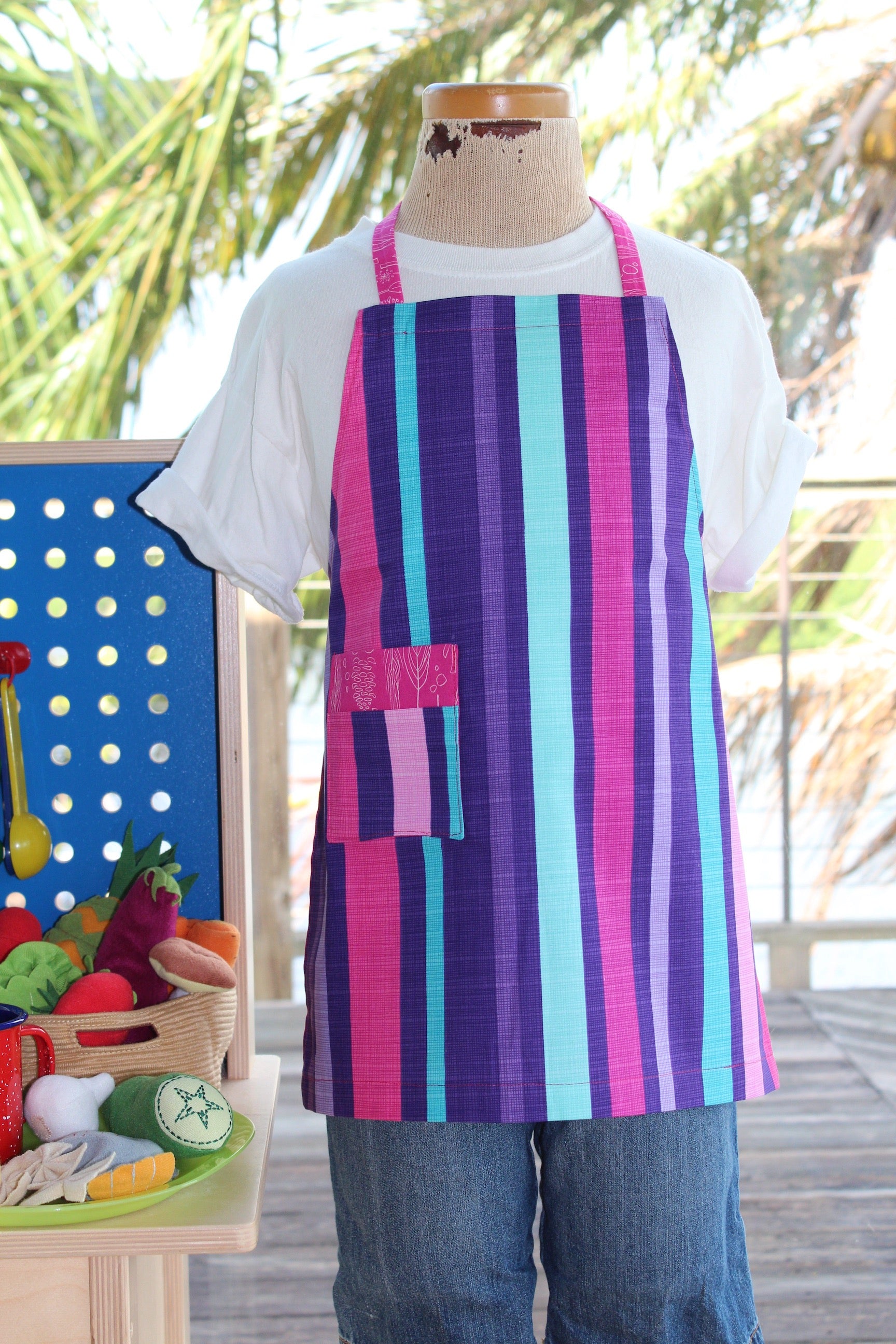 Jewel Box Kid's Apron-The Blue Peony-Age Group_Kids,Category_Apron,Color_Pink,Color_Purple,Color_Teal,Department_Kitchen,Gender_Girls,Material_Cotton,Pattern_Graphic,Pattern_Stripes,Size_Small (ages up to 5)